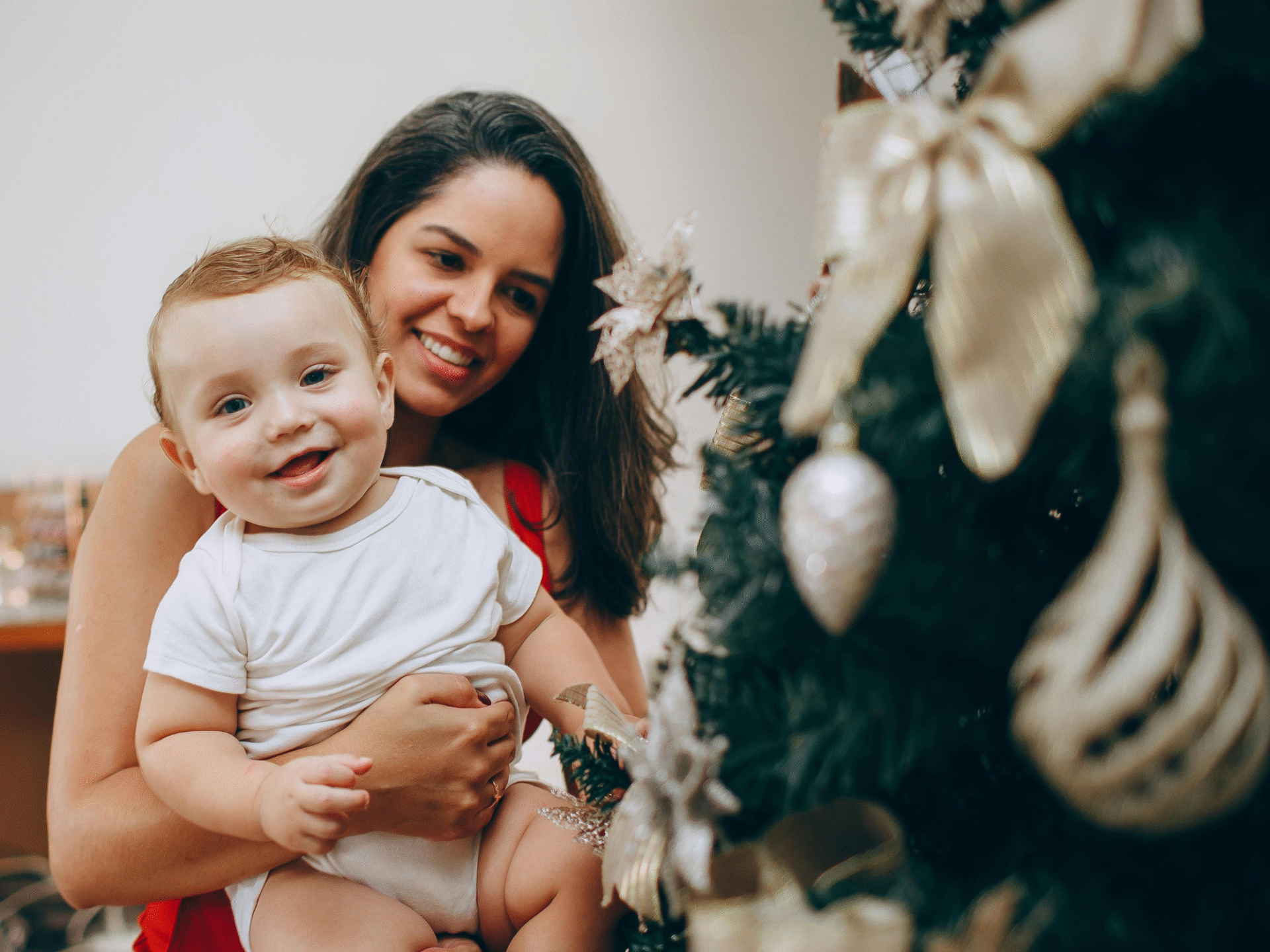 Mother and child looking at Christmas tree