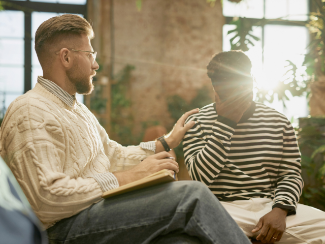A one-to-one counselling or support session, highlighting compassionate listening and emotional support in a welcoming environment.