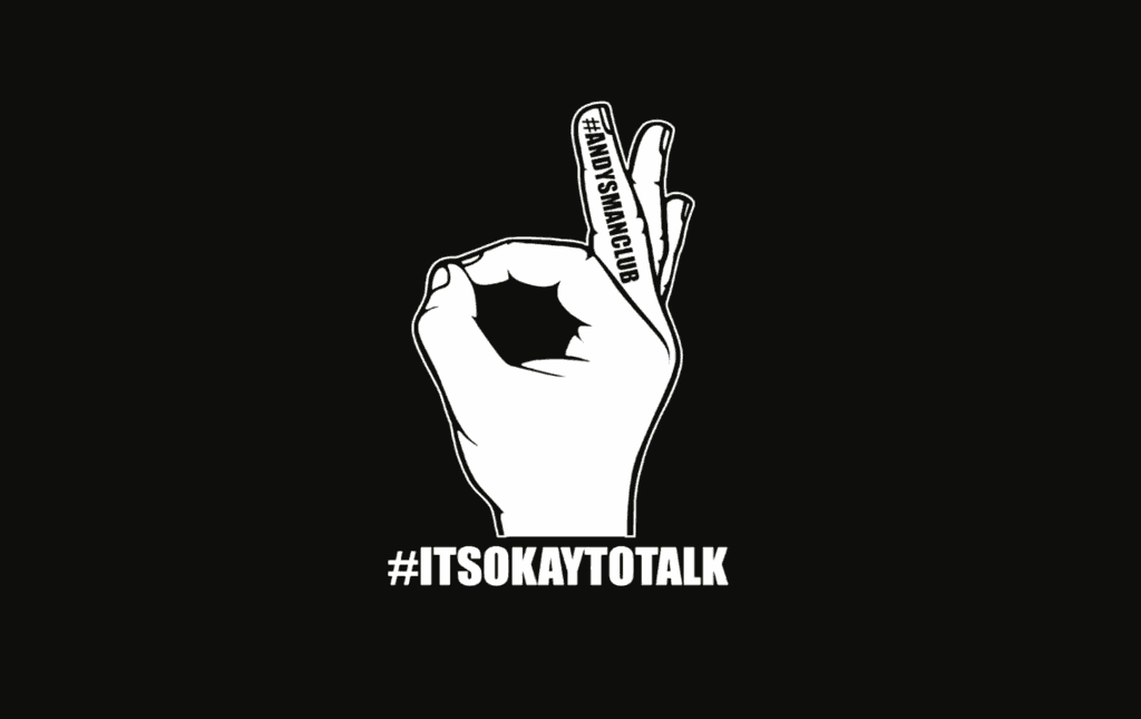 Logo of ANDY’S MAN CLUB showing a hand making an ‘OK’ sign, symbolising support, with the words ‘It’s OK to talk’.