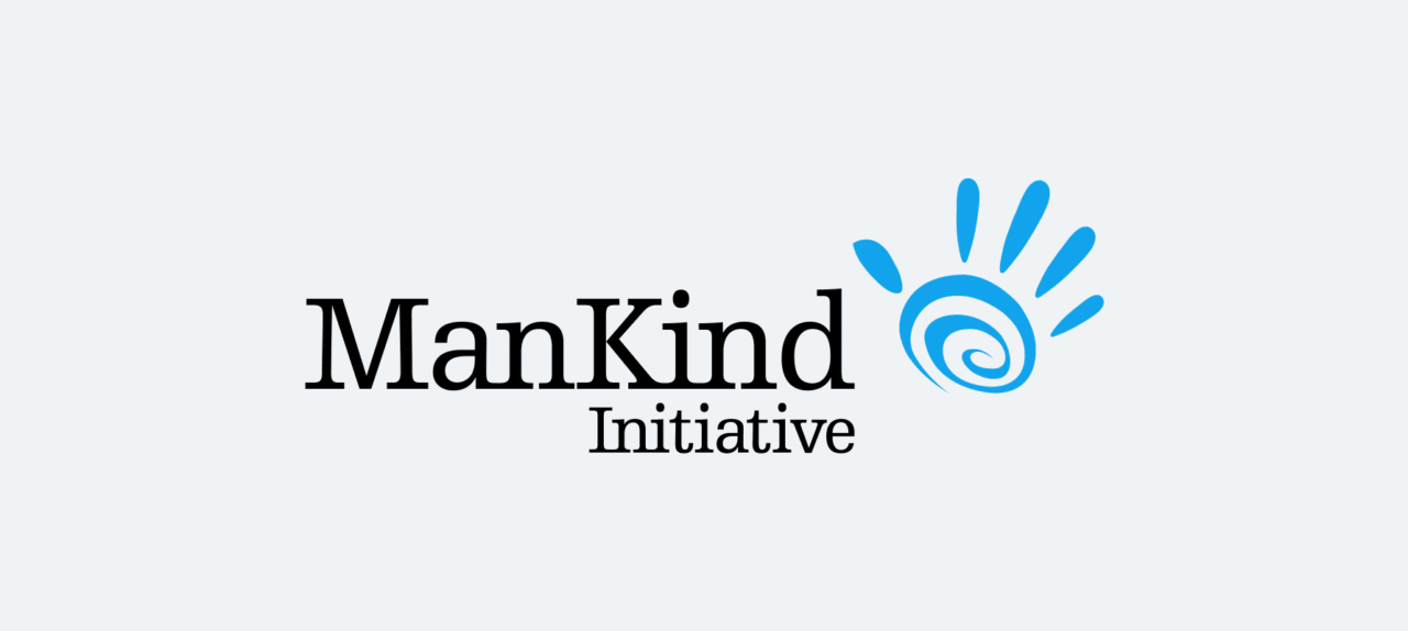 Logo for the ManKind Initiative, featuring the words “ManKind Initiative” in black text alongside a blue spiral with handprint-style shapes radiating outward.